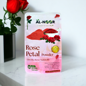 Al-Noor Rose Petal Powder pouch placed on a white surface with a red rose in the background, promoting natural glow and skincare.